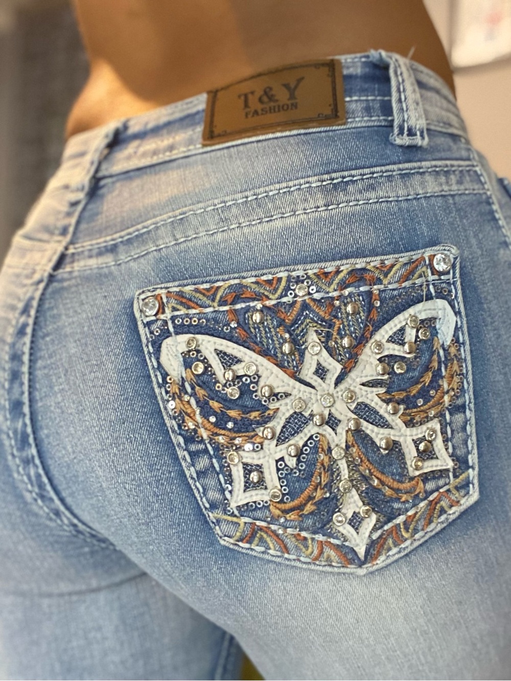 Light Blue Boot Cut Jeans with Embellished Back Pocket
